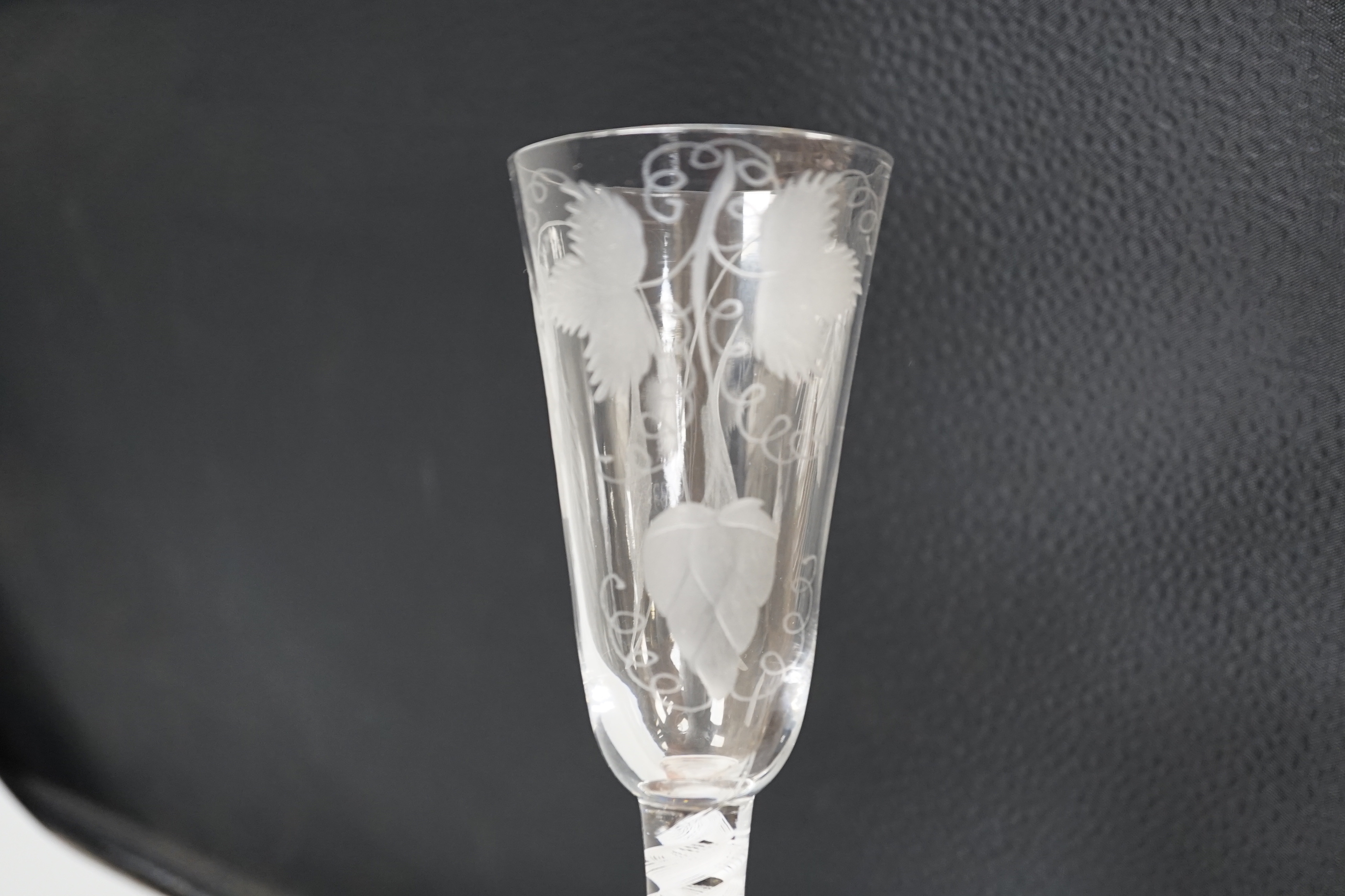 An English lead crystal SSOT ale glass, c.1760, the elongated round funnel bowl engraved with hops and barley, the stem with a rare SSOT scrambled eighteen ply spiral band, conical foot, snapped pontil, tool marked and s